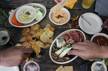 spread of bar food in compostable fiber bowls