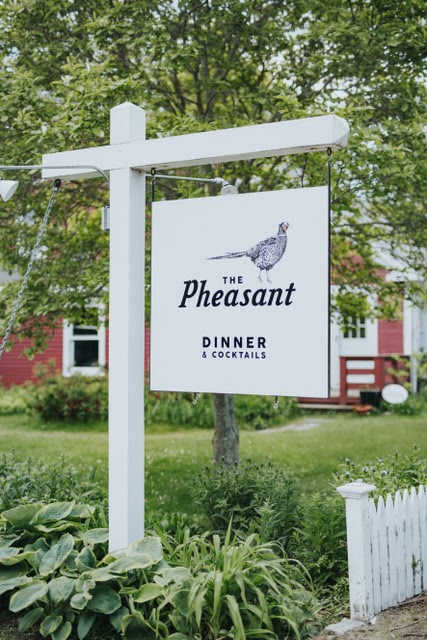 Entrance sign for The Pheasant restaurant