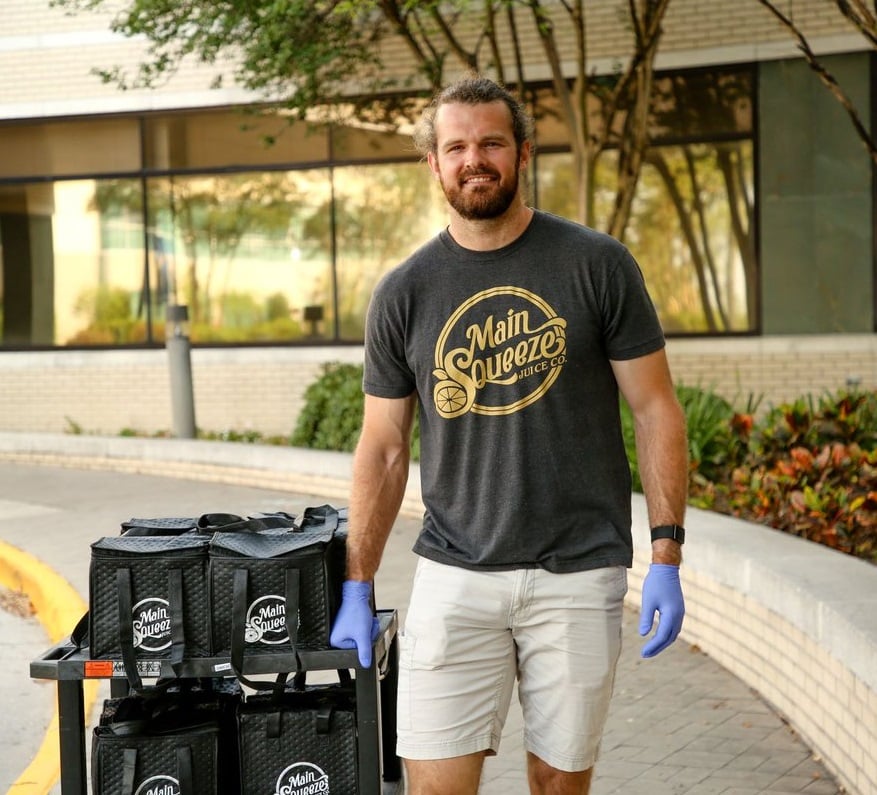 New Orleans Saints punte and Main Squeeze Juice Co. co-owner delivering immune-boosting shots to frontline workers